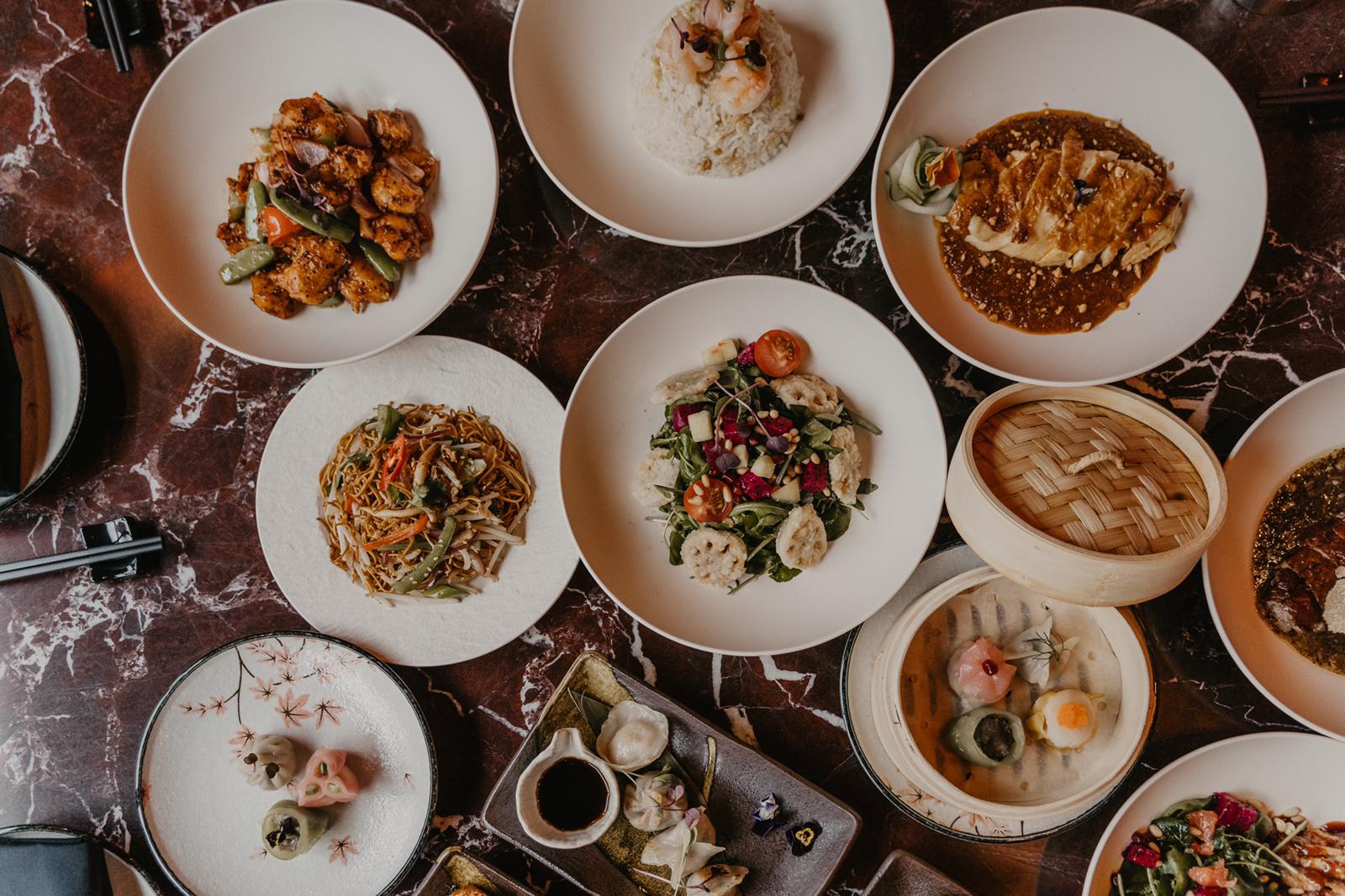 A table of Chinese sharing plates and dim sum for bottomless brunch at Lulu Wild, Birmingham