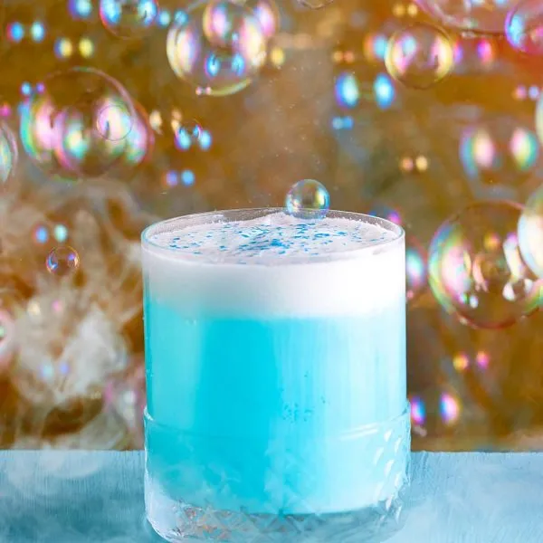 A blue cocktail under a cloud of bubbles at Lulu Wild, Birmingham