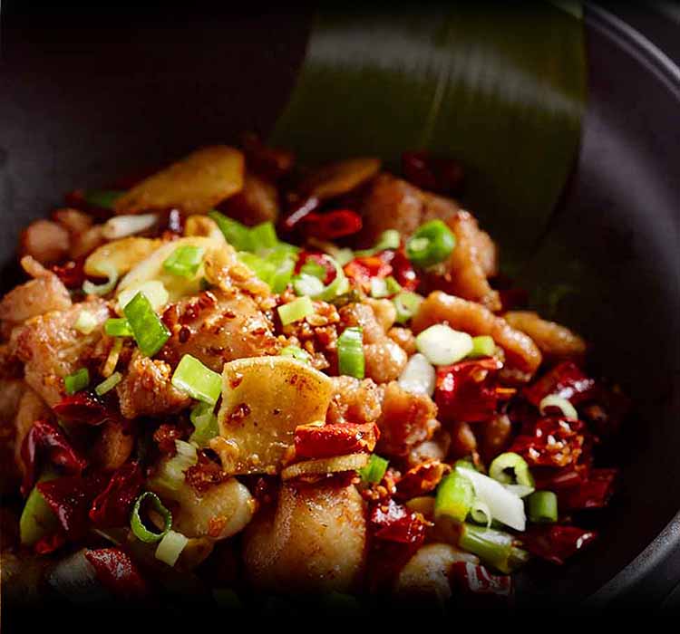 Sizzling wok dish with dried chillies at Lulu Wild, Chinese restaurant in Birmingham