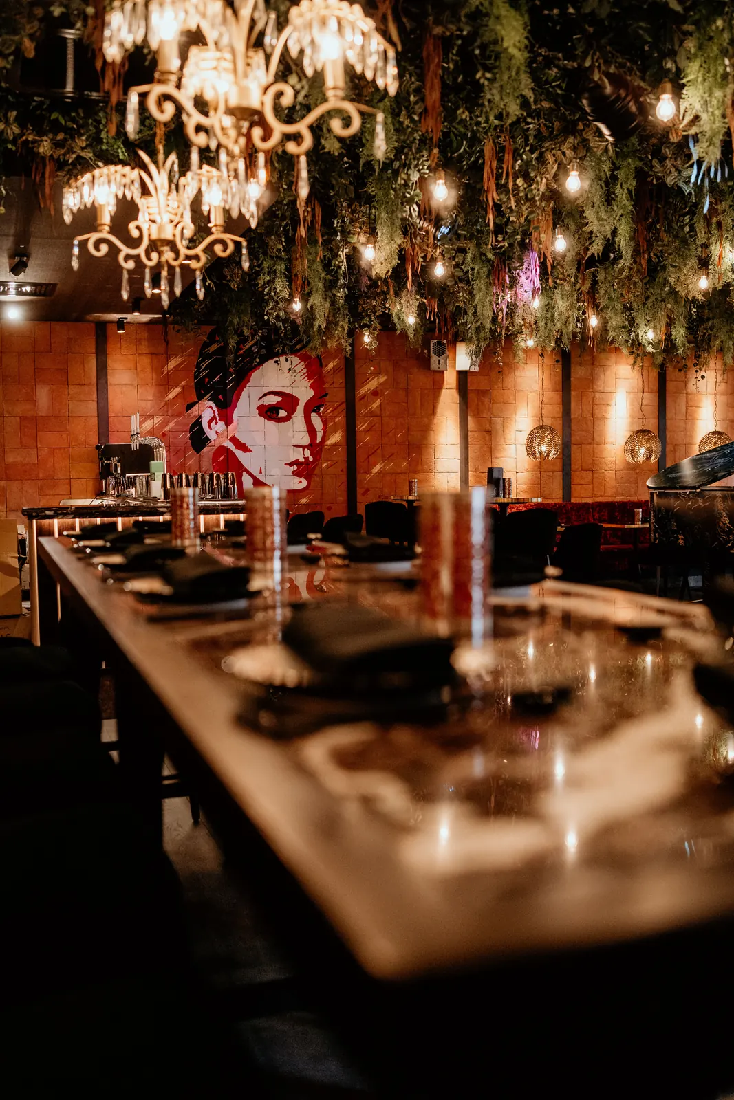 Private dining space set under chandeliers at Lulu Wild, Brindleyplace, Birmingham